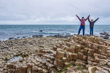 Mother and son at Giants causeway in autumn, Northern Ireland