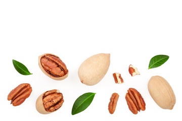 pecan nut decorated with green leaves isolated on white background. Top view. Flat lay