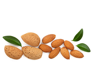 almonds with leaves isolated on white background with copy space for your text. Top view. Flat lay pattern