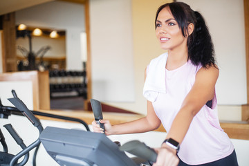 Fototapeta premium Fitness girl workout in the gym. Exercises for women, bodybuilder train, sports lifestyle