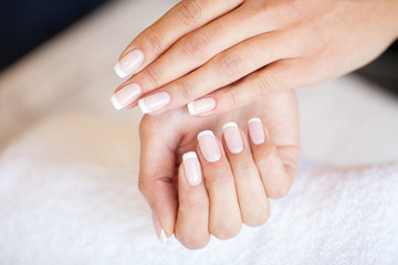 Obraz na płótnie Canvas Manicure. Nails master doing manicure in beauty studio