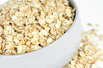 Oat flakes in bowl closeup