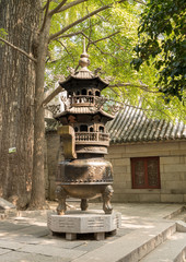 Burning incense at Temple of Supreme Purity or Tai Qing Gong at Laoshan