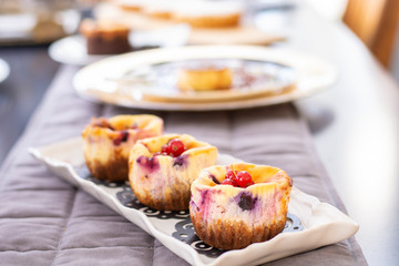 Muffins with fresh blueberry, blackberry, cranberry and strawberry