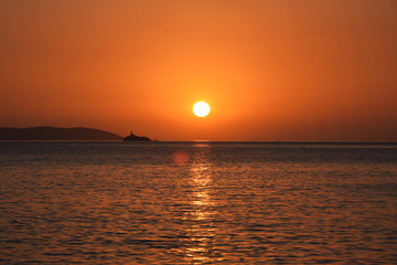 Golden hour Sundown, with view to Korfu island. Sunset on the beach in Ksamil near Saranda, Albania.