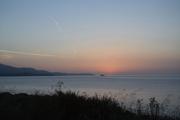 Golden hour Sundown, with view to Korfu island. Sunset on the beach in Ksamil near Saranda, Albania.