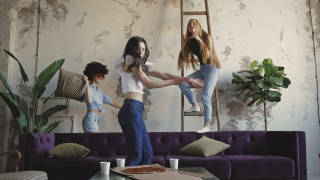 group mixed race young pretty girls having fun at home