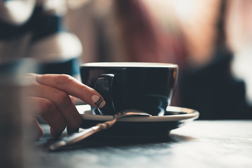 Coffee break in a small cup in the middle of the day.