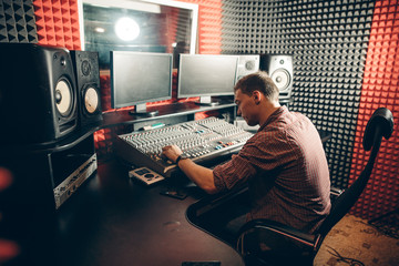 sound engineer at workplace. pleasant sound operator at work.interest, hobby. free time