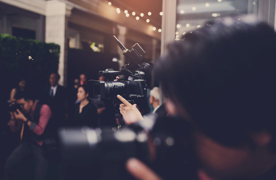 videographer close up, cameraman, movie, man with camera, movie, professional camera