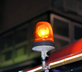 Blurry alarm siren sounds and lights up the night