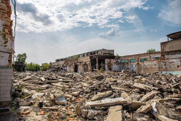 Earthquake or war aftermath or hurricane or other natural disaster, broken ruined abandoned buildings, pills of concrete garbage