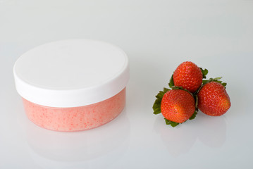Cosmetics. strawberry scrub on black background