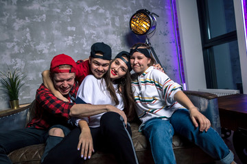 four cheerful dancers are posing to the camera before the concert. close up photo.closeness, togetherness