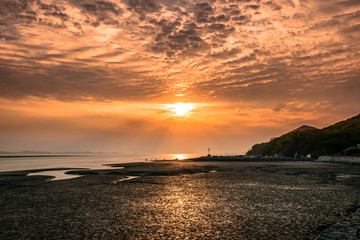 Beautiful scenery of the beach at sunset