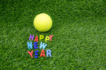 Naklejka premium Tennis Happy New Year with tennis on green grass