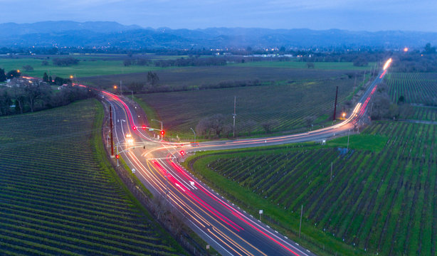 Aerial light trails over Sonoma Road by Vineyards