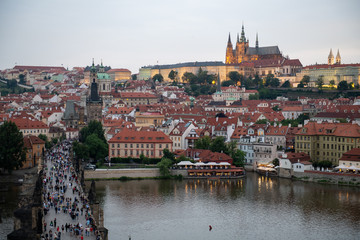 Prague, Czech Republic. Charles Bridge and Hradcany (Prague Castle) with St. Vitus Cathedral and St. George church evening dusk, Bohemia landmark in Praha.