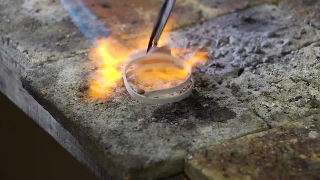 calefaction and wetting of curved silver blanks with flux (composition against oxidation), workshop jewelry