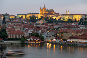Obraz premium Prague, Czech Republic. Charles Bridge and Hradcany (Prague Castle) with St. Vitus Cathedral and St. George church evening dusk, Bohemia landmark in Praha.