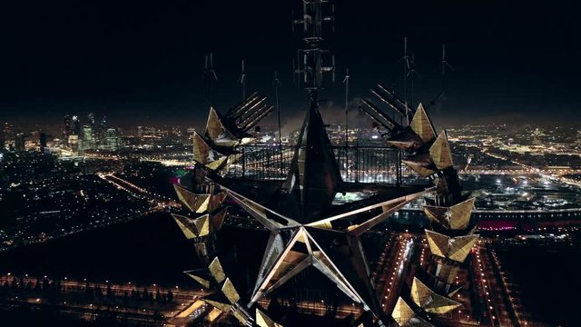 Russian Red star on a dark night sky background.On top of main building of Lomonosov Moscow State University (MSU) on Sparrow Hills,famous Stalin skyscraper and science and education symbol in Russia
