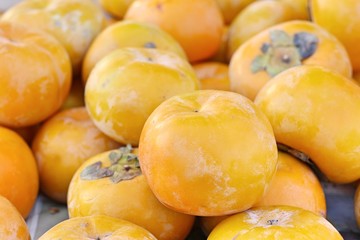 Naklejka na ściany i meble Persimmon fruit at street food
