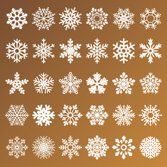 collection of golden vector snowflakes on white background