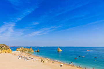 Picturesque view of Praia do Camilo beach in Lagos, Algarve region, Portugal. Praia do Camilo is one of the best beaches in Lagos. Famous for the crystal clear water and impressive cliff formations