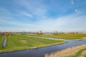 Obraz premium Landscape of well-preserved historic windmills and houses