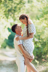 Fototapeta premium Young couple laying on park lawn