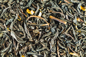 Black tea, dry leaves with flowers for all photos. Wallpaper
