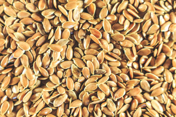 Flax seed, a lot on the whole background. Linen. Close up