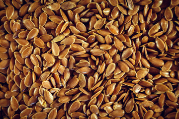 Flax seed, a lot on the whole background. Linen. Close up