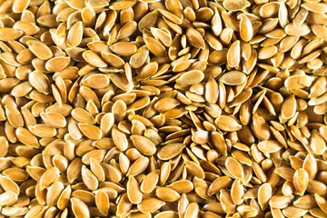 Flax seed, a lot on the whole background. Linen. Close up