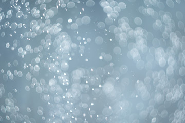 falling snow, abstract blue bokeh background