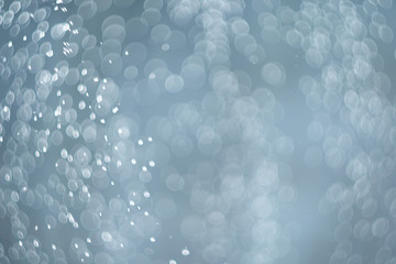 falling snow, abstract blue bokeh background
