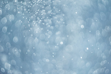 falling snow, abstract blue bokeh background