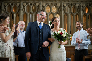 Father of the bride walking his daughter down the aisle