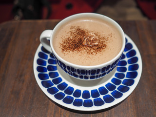 cup of coffee on wooden table