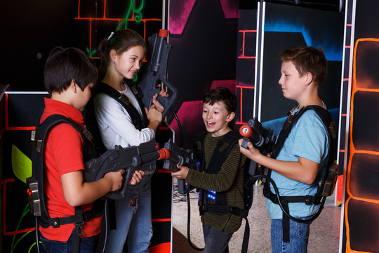 Kids posing with laser pistols