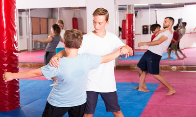 Fototapeta na wymiar Kids exercising self-defense movements