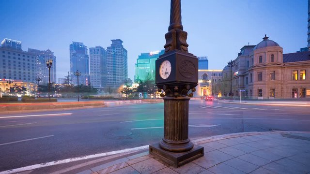 Urban traffic in Dalian, China, car light trails on the evening road, time lapse