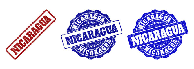 NICARAGUA scratched stamp seals in red and blue colors. Vector NICARAGUA watermarks with distress surface. Graphic elements are rounded rectangles, rosettes, circles and text titles.