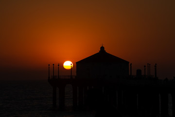 Silhouette of Manhattan beach pier during beautiful sunset in California