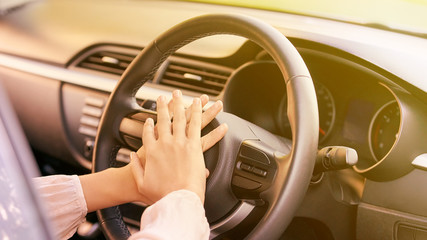 Young woman in car. Ride instruction. Automobile loan