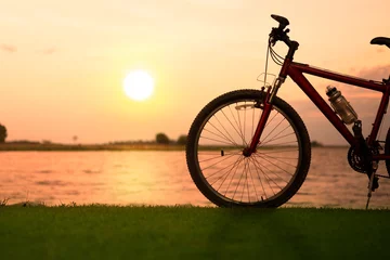 Papier Peint photo autocollant Vélo Silhouette bicycle with sunset or sunrise background