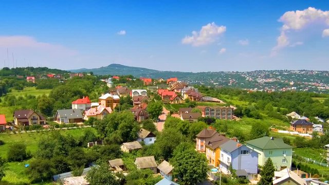 Flight over the village towards mountain. FullHD 1080p.