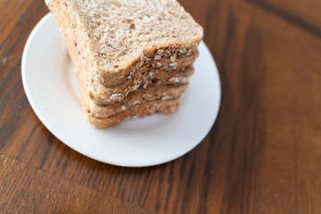 Slices of Whole grain bread on white plate