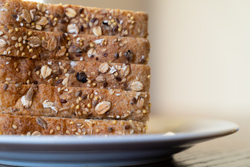 Slices of Whole grain bread on white plate