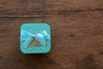 Gift boxes with ribbon on brown wooden background,Top view with copy-space